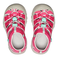 Pink children's sandals with white soles on a white background