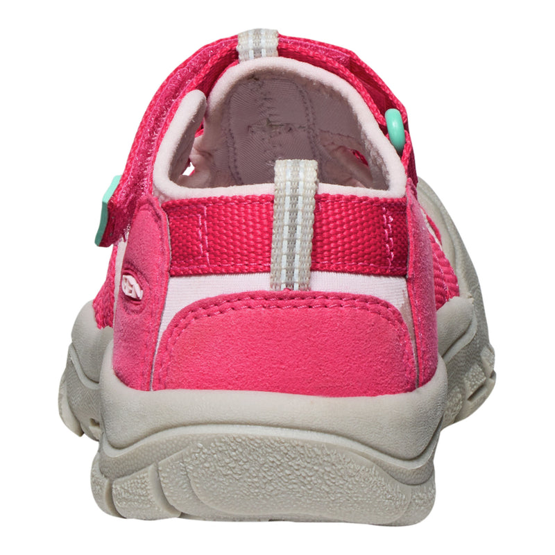 Pink children's sandal with a white sole on a white background