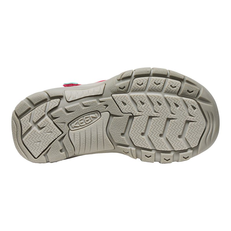 Close-up of a shoe sole with a brand logo on a white background