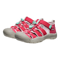 Pink and beige sandals with turquoise accents on a white background