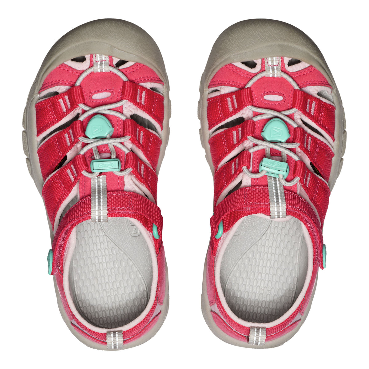 Pair of red and gray sandals with green accents on a white background