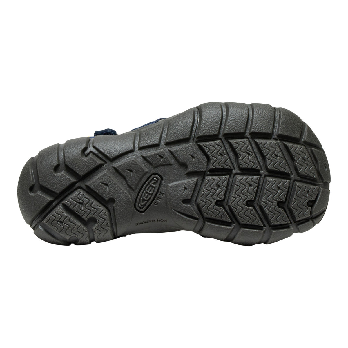 Close-up of a black hiking boot sole with brand logo on a white background