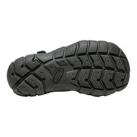 Close-up of a black hiking boot sole with brand logo on a white background