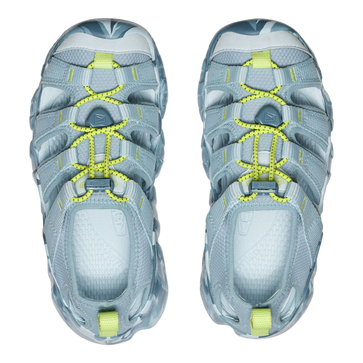 Pair of blue athletic shoes with yellow accents on a white background