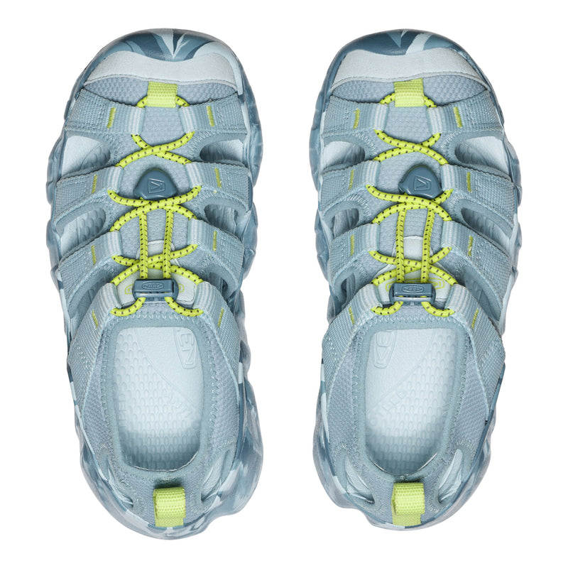 Pair of blue athletic shoes with yellow accents on a white background
