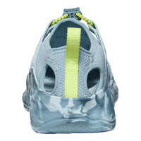 Close-up of a gray sandal with a yellow strap on a white background