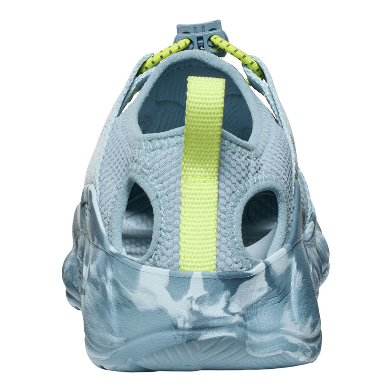 Close-up of a gray sandal with a yellow strap on a white background