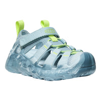 Blue children's sandal with clear sole and green straps on a white background