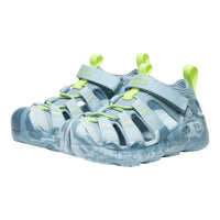 Pair of light blue children's sandals with green straps on a white background