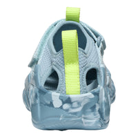 Light blue sandal with a green strap on a white background