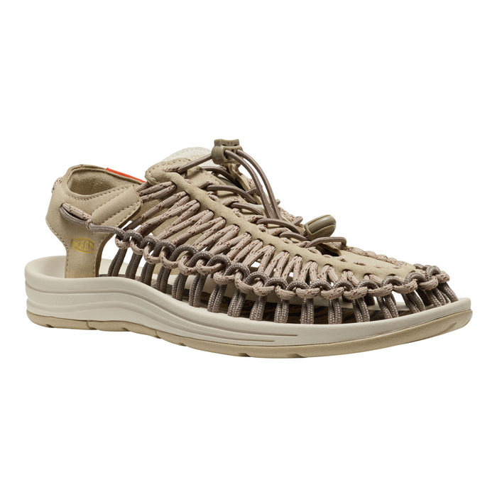 Beige sandal with braided design on a white background