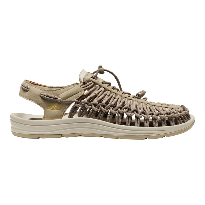 Beige sandal with woven design on a white background
