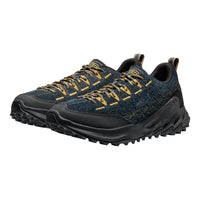 Pair of blue and black hiking shoes with yellow accents on a white background