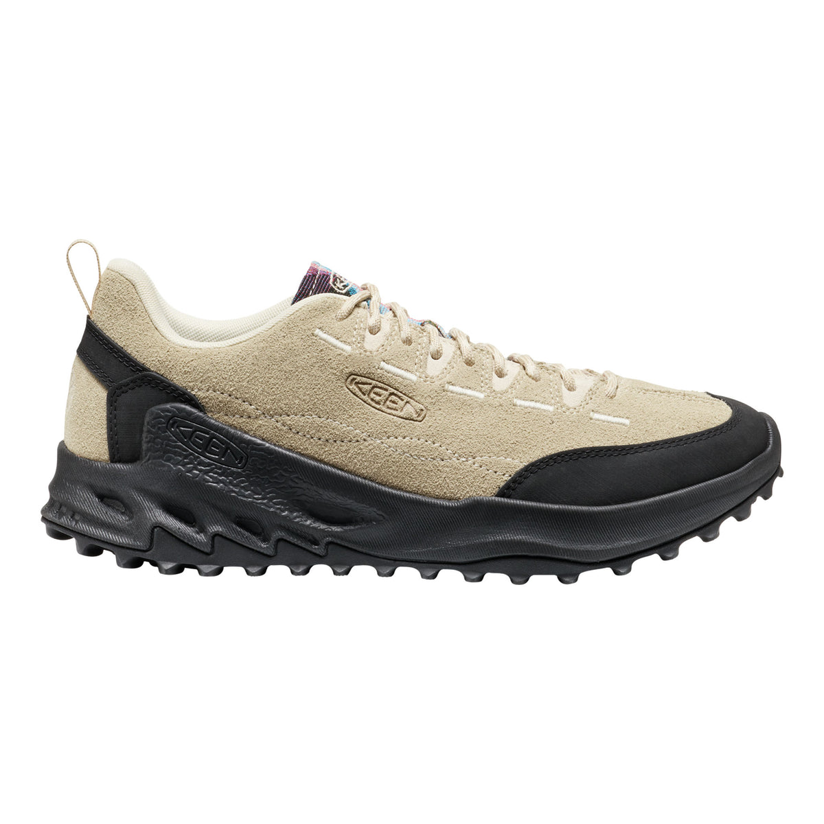 Beige and black sneaker with brand logo on a white background