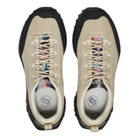 Pair of beige KEEN shoes with black soles on a white background