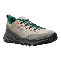 Hiking shoe with green laces and gray sole on a white background
