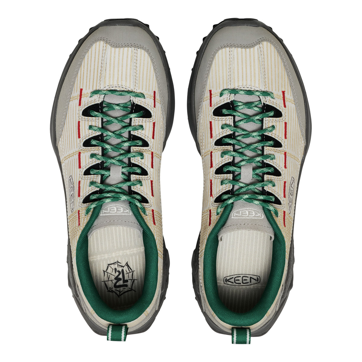 Pair of Keen shoes with green laces on a white background