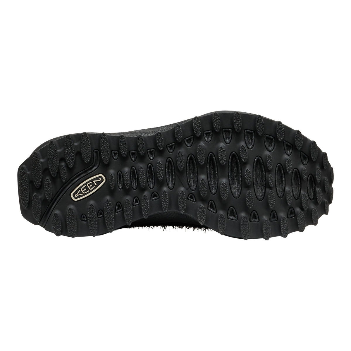 Black shoe sole with tread pattern on a white background