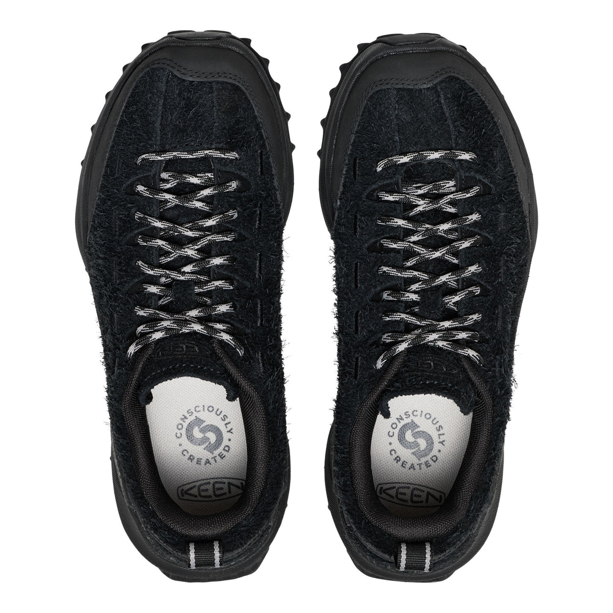 A pair of black KEEN walking shoes shown from a top-down view, featuring textured black uppers, fuzzy black lining, and white-and-black patterned laces, set against a plain white background.