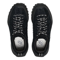 A pair of black KEEN walking shoes shown from a top-down view, featuring textured black uppers, fuzzy black lining, and white-and-black patterned laces, set against a plain white background.