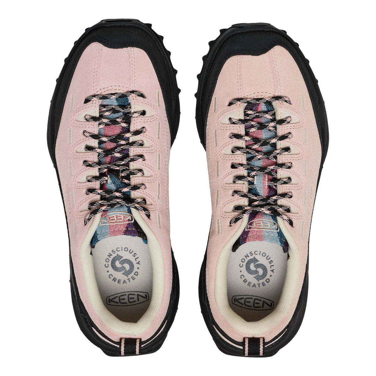 Pink hiking boots with black soles on a white background