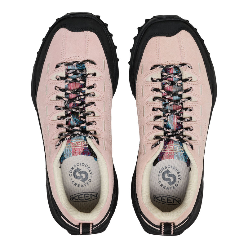 Pink hiking boots with black soles on a white background