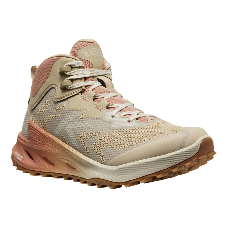Beige and brown hiking shoe on a white background