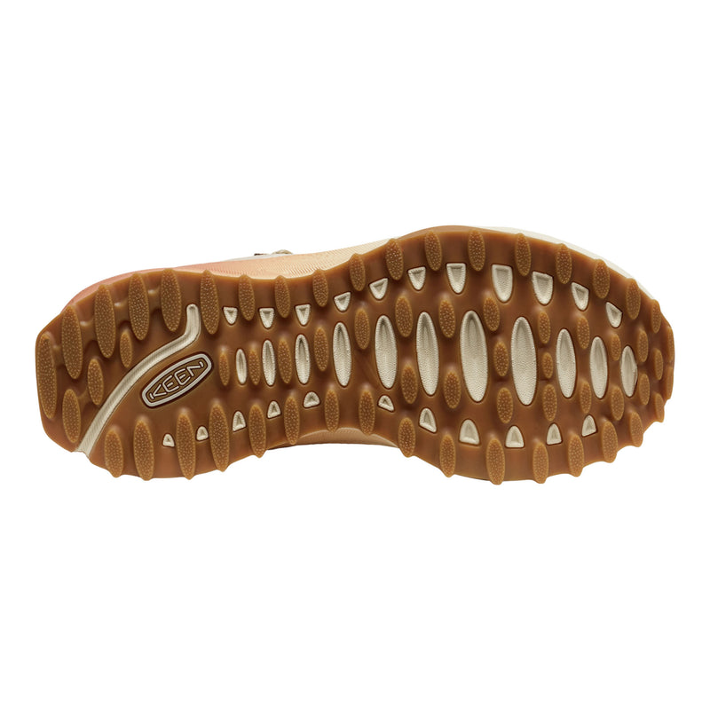 Close-up of a brown shoe sole with a brand logo on a white background