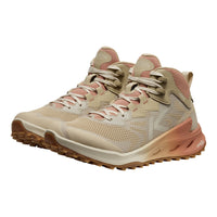 Beige and pink hiking boots on a white background