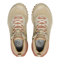 Pair of beige and pink KEEN hiking shoes on a white background