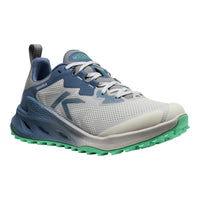 A trail shoe from Keen, featuring a light gray and slate blue mesh upper, a thick blue midsole, and a green-tipped outsole, shown against a plain white background.