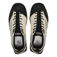 Pair of black and white Keen shoes on a white background