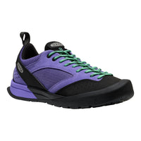 Purple and black sneaker with green laces on a white background
