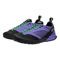 Purple and black sneakers with green laces on a white background