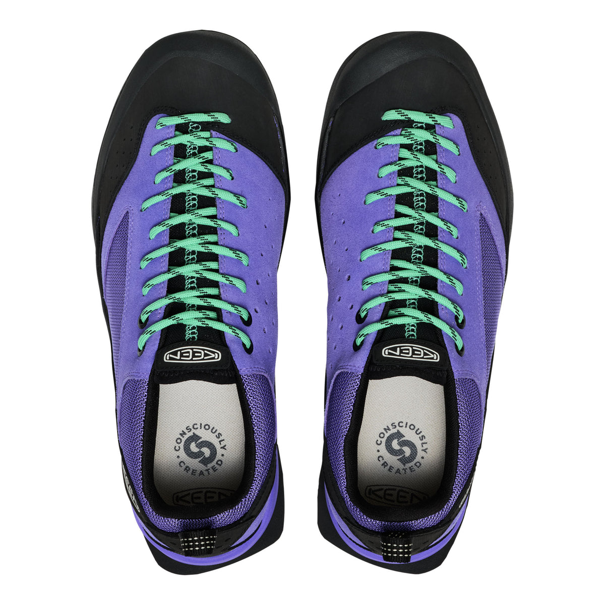 Purple sneakers with green laces on a white background