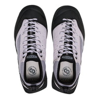 Pair of black and white KEEN shoes on a white background
