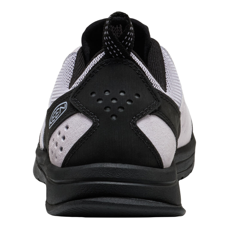 Black and white athletic shoe with brand logo on a white background