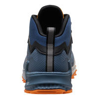 Blue athletic shoe with orange sole on a white background