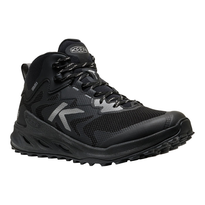 A black Keen mid-cut hiking boot with gray reflective accents and a rugged sole, shown from a three-quarters angle on a white background.