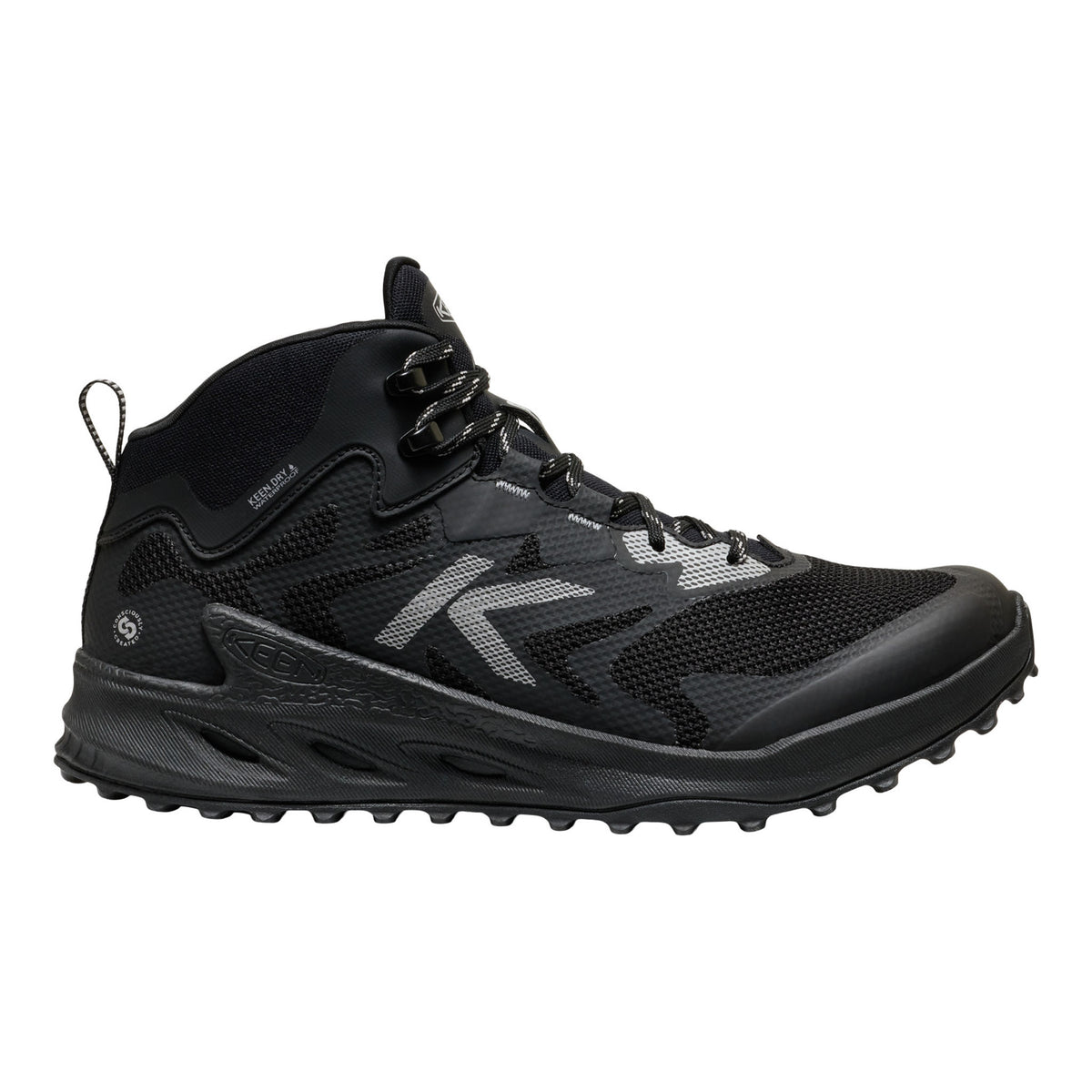 A black mid-cut athletic shoe with a textured sole, black laces, and a prominent silver stylized 'K' logo on the side, shown against a plain white background.