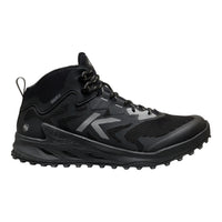 A black mid-cut athletic shoe with a textured sole, black laces, and a prominent silver stylized 'K' logo on the side, shown against a plain white background.