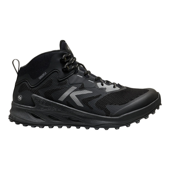 A black mid-cut athletic shoe with a textured sole, black laces, and a prominent silver stylized 'K' logo on the side, shown against a plain white background.