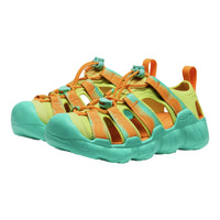 Pair of green and orange sandals on a white background