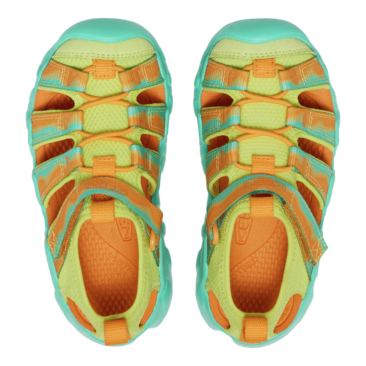 Pair of colorful sandals with orange and green pattern on a white background