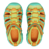 Pair of colorful sandals with orange and green pattern on a white background