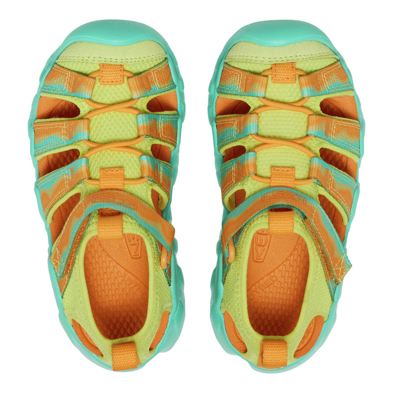 Pair of colorful sandals with orange and green pattern on a white background