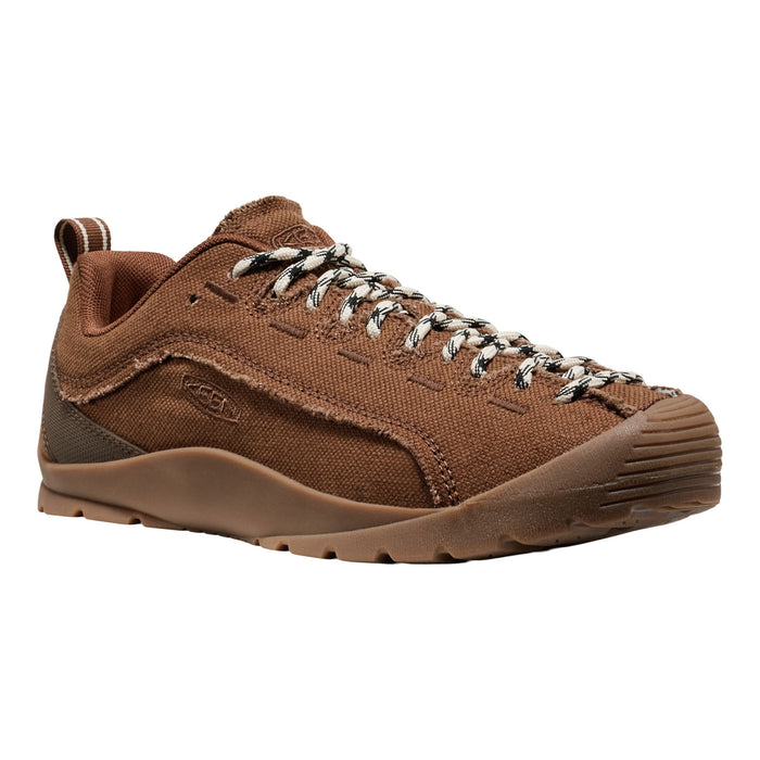 A brown canvas lace-up shoe with a matching brown sole and silver-and-white speckled laces, shown from a three-quarters angle on a white background.