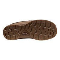 A close-up, top-down view of a brown textured shoe sole, showing the tread pattern and a visible Keen logo in the center, set against a plain white background.