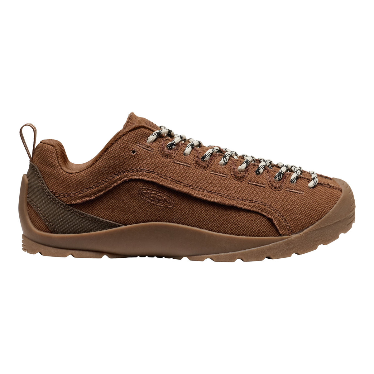 A brown canvas lace-up shoe with silver metal eyelets and a matching brown sole, shown in a side profile on a white background.