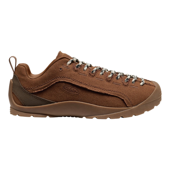 A brown canvas lace-up shoe with silver metal eyelets and a matching brown sole, shown in a side profile on a white background.